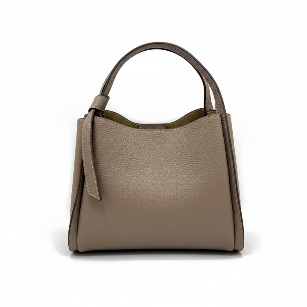 A taupe pebbled leather handbag with a top handle, shown from the front against a plain white background.
