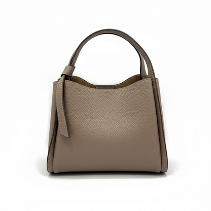 A taupe pebbled leather handbag with a top handle, shown from the front against a plain white background.