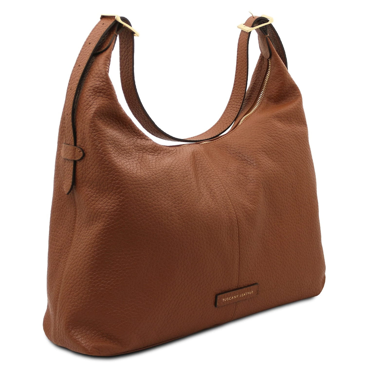 Primer plano of brown piel granulada hobo bag with double straps and Tuscany Leather label.