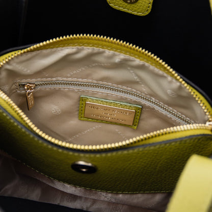 Inside view of the Soave soft leather handbag with beige lining, a zipped pocket and a gold brand label.