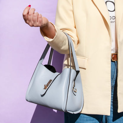 Soft light blue leather handbag with two top handles and gold hardware