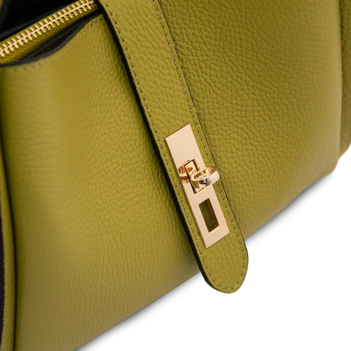 Close up of the olive green strap with a gold rectangular clasp on the Soave handbag