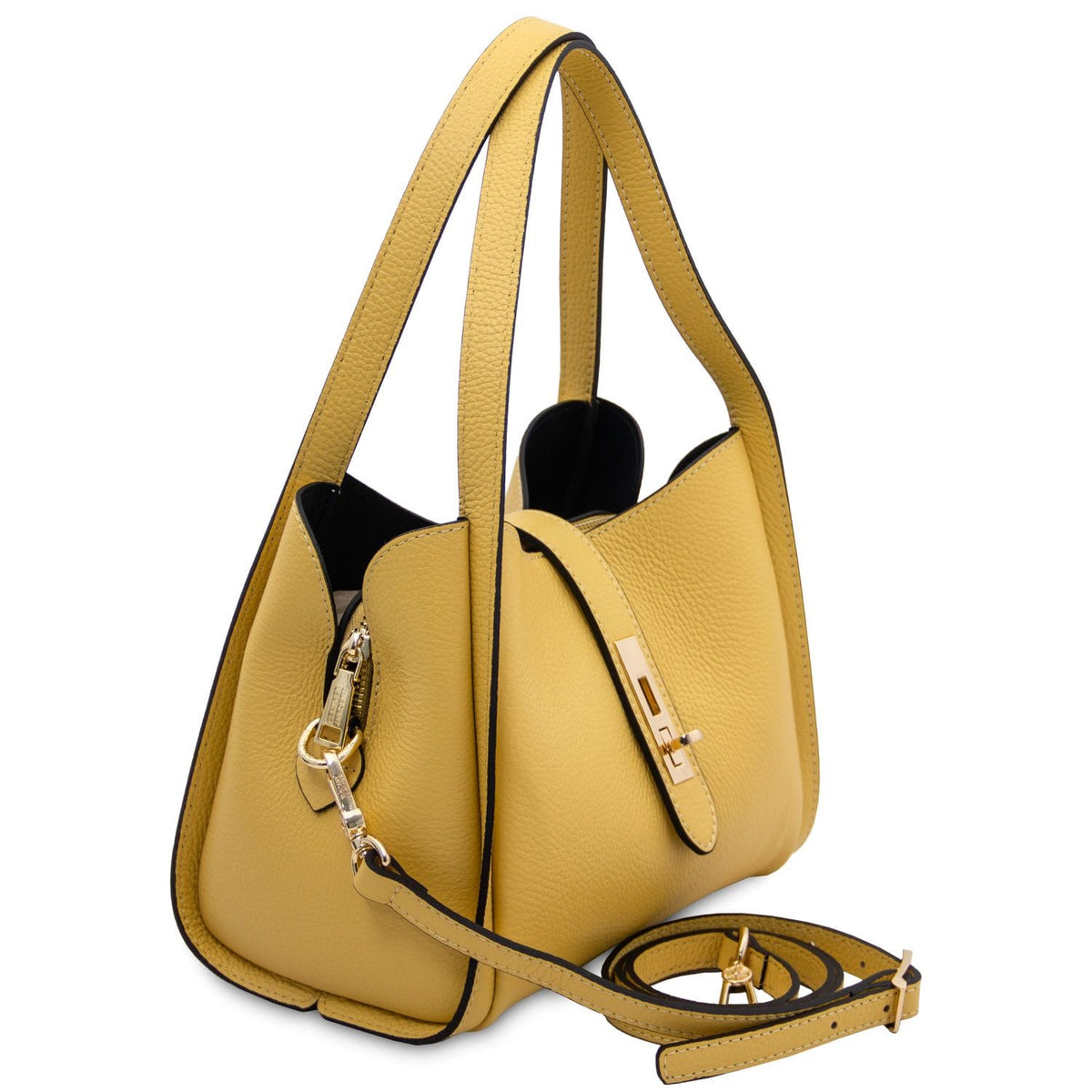 Side view of a mustard yellow leather handbag with a detachable strap.