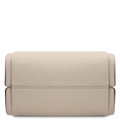 Beige soft leather handbag bottom panel with visible stitching.