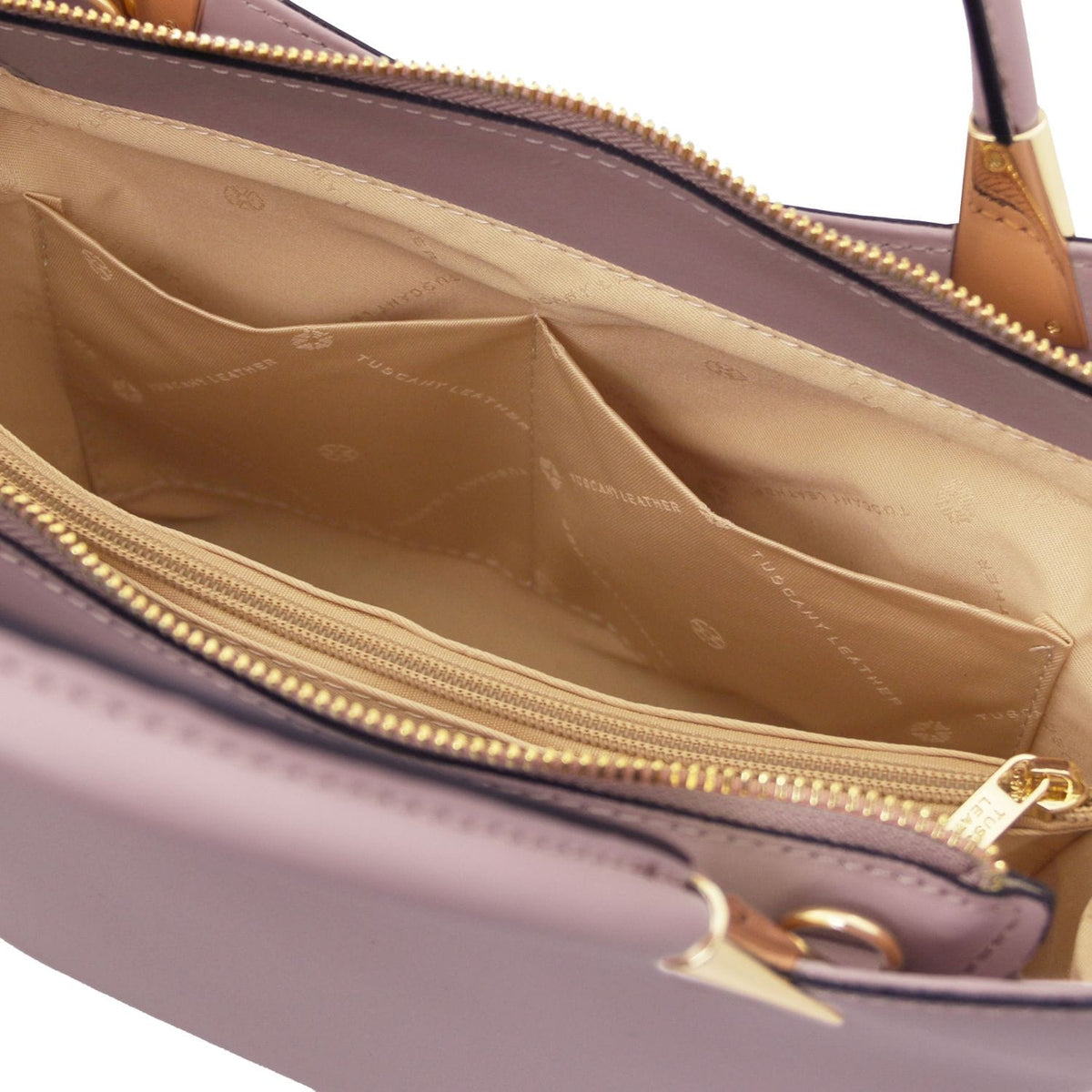 Beige interior of lavender TL bag with zip pocket and inner compartments