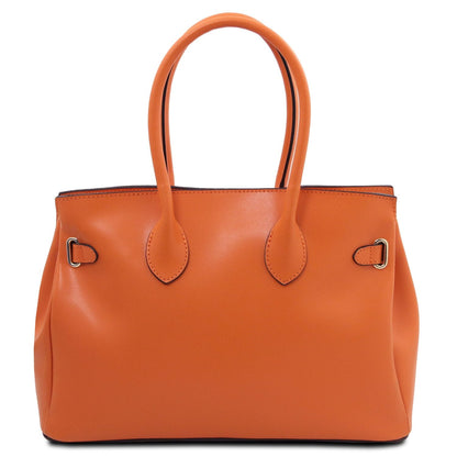 Naranja piel lisa handbag with double handles and minimal metal hardware accents in a structured silhouette.
