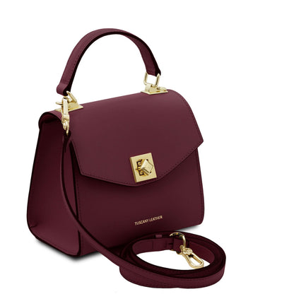 TL Bag - Leather mini bag | TL142203 in burgundy leather with top handle, gold-tone turn-lock clasp, and detachable shoulder strap on white background