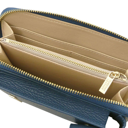 Blue leather wallet opened to beige interior featuring card slots and a gold zipper pocket
