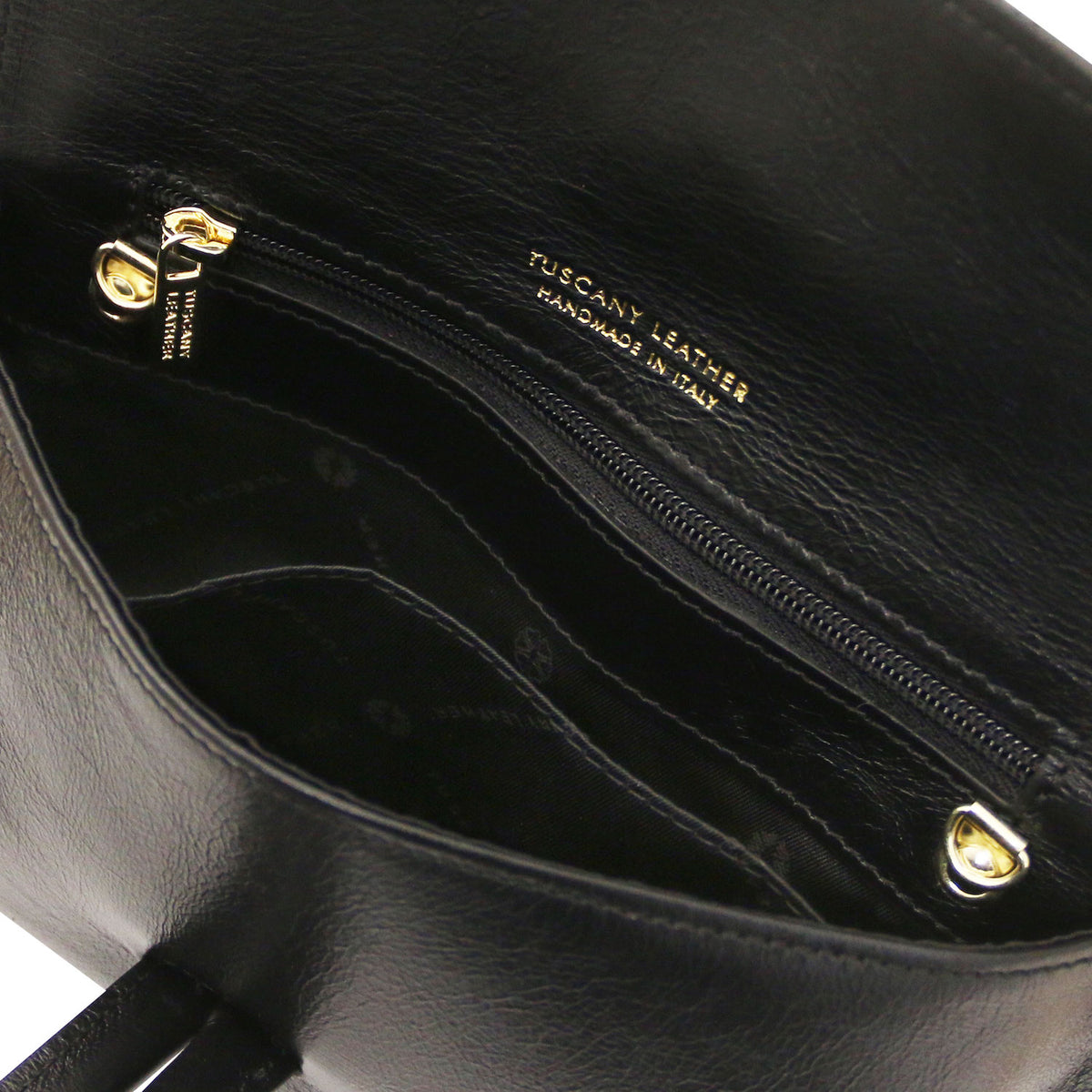 TL Bag - Metallic leather clutch | TL141993 in black leather with internal zip pocket and gold zipper hardware on close-up view.