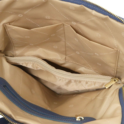 Cognac interior of TL Bag with ritsvak and organized slots.