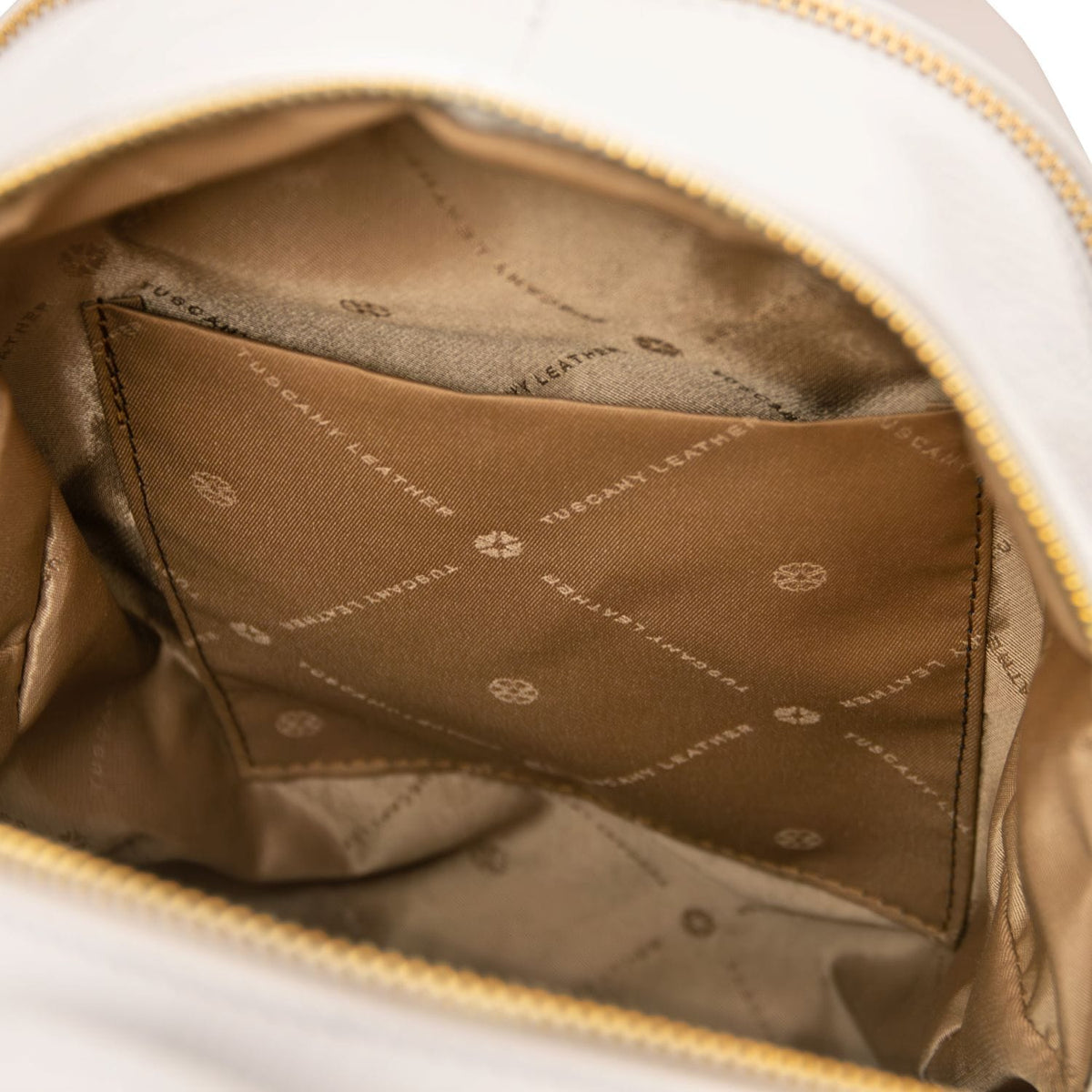 Interior with brown lining and stitched pocket panel inside TL Bag cuir souple backpack