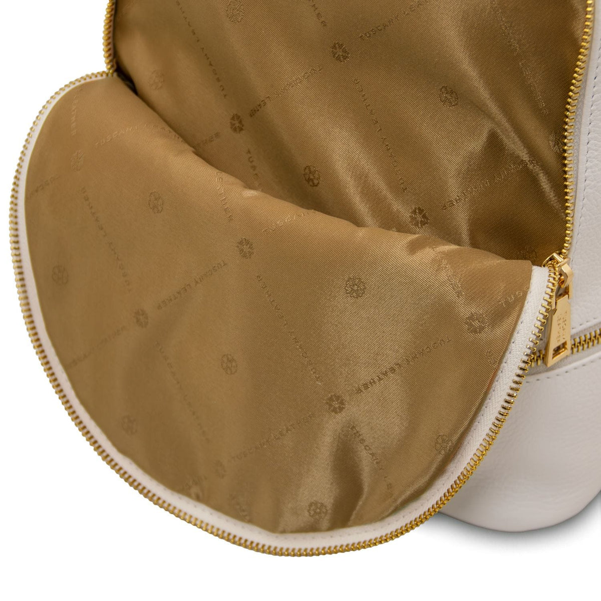 Cognac doublure intérieure with subtle logo pattern and fermeture zippée dorée of the TL Bag cuir souple backpack