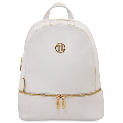Crème white cuir souple backpack with gold-tone zippers and a round plaque logo dorée on the front.