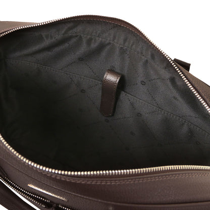 Open Treviso leather laptop briefcase showing dark lining and internal strap anchor.