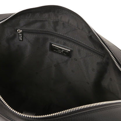 Inside view of Treviso leather laptop briefcase with zip pocket and brand plaque on black lining.