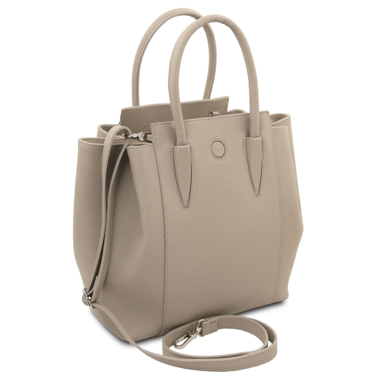 Beige Italian leather handbag with pebbled texture, double handles, and detachable shoulder strap, showcasing clean minimalist design.