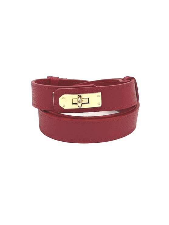 Women’s Adjustable Skinny Leather Belt – Handcrafted in Italy in deep red leather with gold-tone buckle and textured finish.