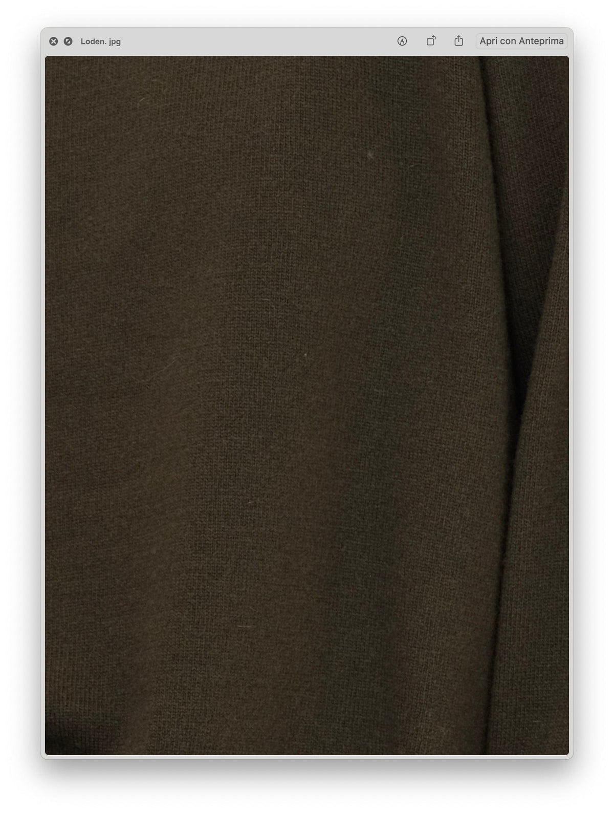 Close-up of the soft textured fabric in a muted olive tone of the Wool & Cashmere Mix High Neck Sweater with Zip.