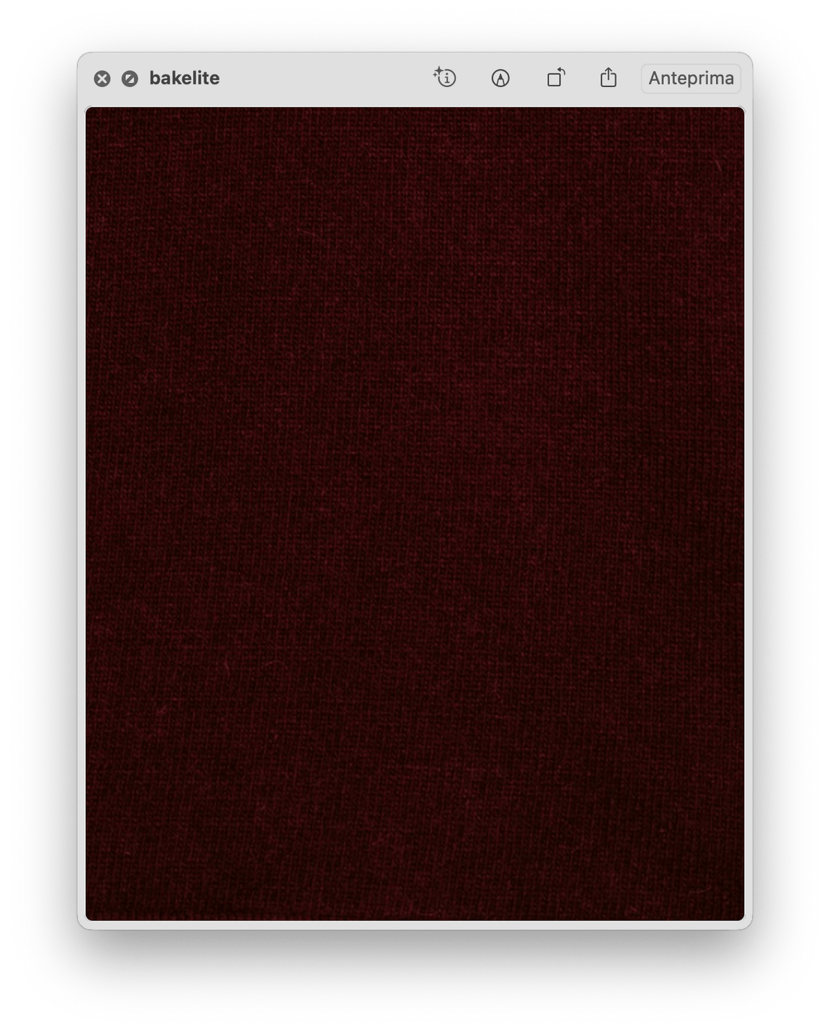 Close-up view of rich burgundy knit fabric highlighting the soft texture of the Wool & Cashmere Mix Maxi V-Neck Sweater.